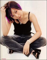 Asian girl with short brown hair, dyed purple at the tips